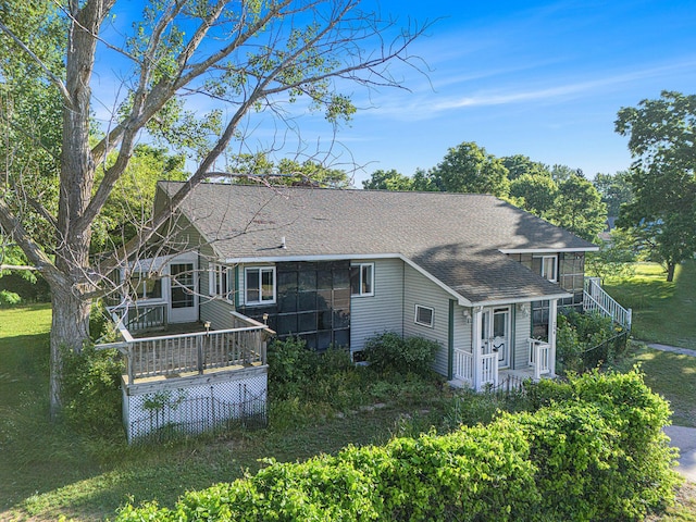 258 Division St, Eastlake, MI 49626 - back of property featuring a shingled roof and a deck