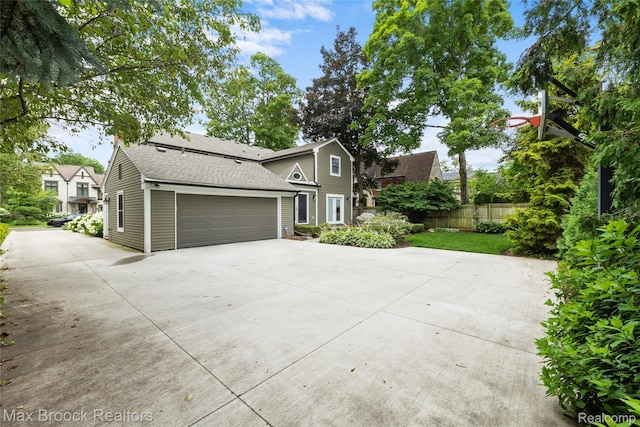 639 N Glenhurst Dr, Birmingham, MI 48009 - traditional-style house featuring driveway, an attached garage, and a shingled roof