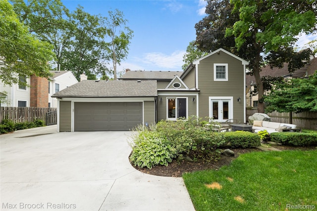 639 N Glenhurst Dr, Birmingham, MI 48009 - traditional home with french doors, concrete driveway, and a garage