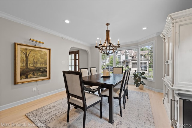 639 N Glenhurst Dr, Birmingham, MI 48009 - dining area with arched walkways, a chandelier, light wood-type flooring, crown molding, and recessed lighting