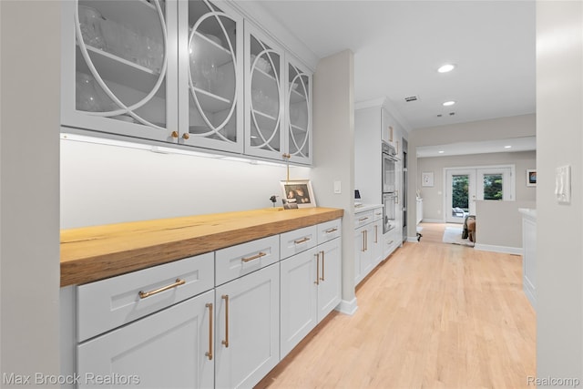 639 N Glenhurst Dr, Birmingham, MI 48009 - corridor with recessed lighting, light wood finished floors, and french doors