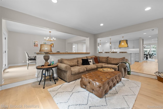 639 N Glenhurst Dr, Birmingham, MI 48009 - living room with light wood-type flooring, a chandelier, and recessed lighting