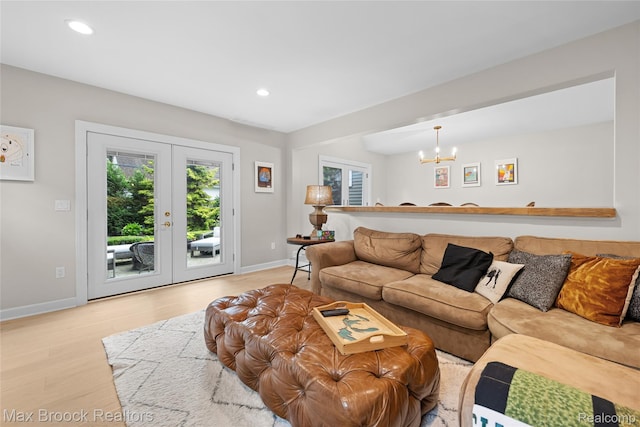 639 N Glenhurst Dr, Birmingham, MI 48009 - living room featuring a chandelier, light wood-style floors, recessed lighting, and french doors