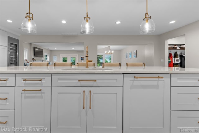639 N Glenhurst Dr, Birmingham, MI 48009 - kitchen with open floor plan, white cabinetry, light countertops, recessed lighting, and pendant lighting