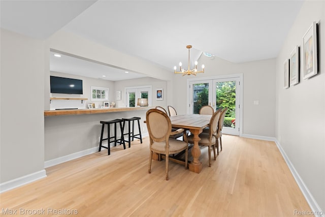 639 N Glenhurst Dr, Birmingham, MI 48009 - dining area with light wood finished floors, a chandelier, and recessed lighting