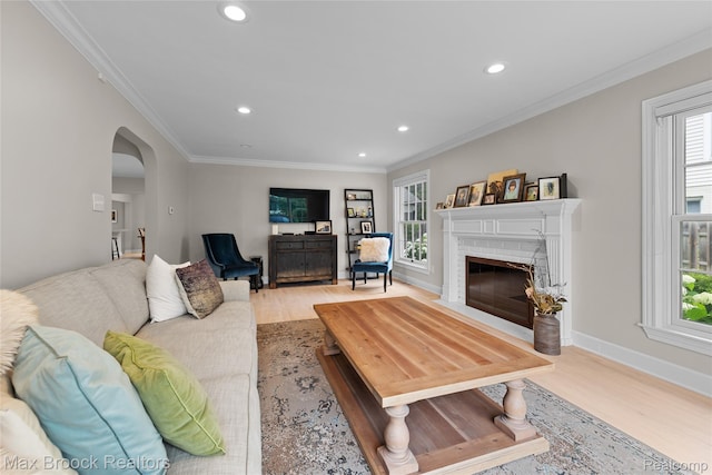 639 N Glenhurst Dr, Birmingham, MI 48009 - living area featuring arched walkways, healthy amount of natural light, light wood finished floors, recessed lighting, and ornamental molding