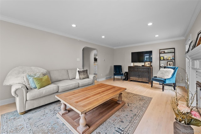 639 N Glenhurst Dr, Birmingham, MI 48009 - living area with arched walkways, recessed lighting, crown molding, and light wood-style flooring