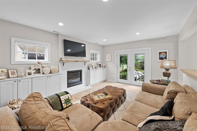 639 N Glenhurst Dr, Birmingham, MI 48009 - living room featuring recessed lighting, a glass covered fireplace, light wood finished floors, and french doors