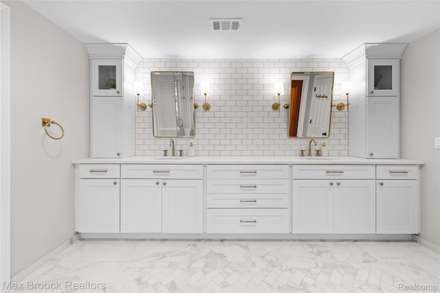 639 N Glenhurst Dr, Birmingham, MI 48009 - full bath with marble finish floors, double vanity, and backsplash
