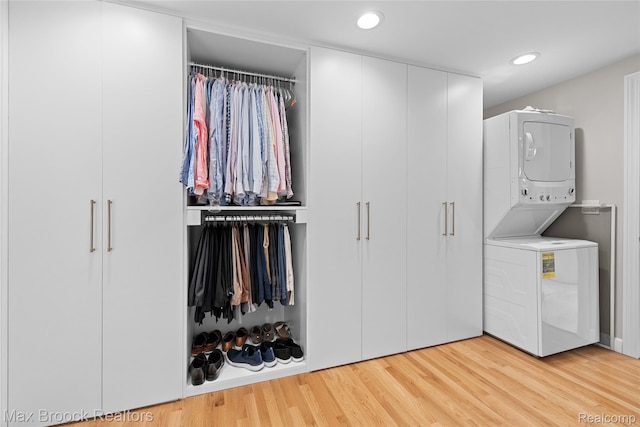 639 N Glenhurst Dr, Birmingham, MI 48009 - laundry area with stacked washer / drying machine, light wood finished floors, and recessed lighting
