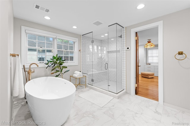 639 N Glenhurst Dr, Birmingham, MI 48009 - full bath with marble finish flooring, a soaking tub, a shower stall, and recessed lighting