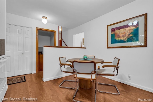 2419 Avondale St W, Sylvan Lake, MI 48320 - dining room featuring wood finished floors and baseboards