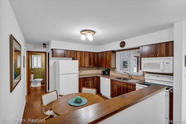 2419 Avondale St W, Sylvan Lake, MI 48320 - kitchen featuring white appliances and wood finished floors