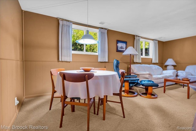2419 Avondale St W, Sylvan Lake, MI 48320 - carpeted dining area featuring healthy amount of natural light and a wainscoted wall