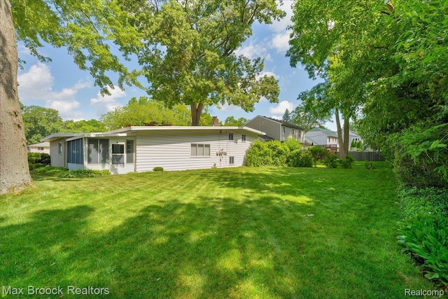 2419 Avondale St W, Sylvan Lake, MI 48320 - back of property featuring a sunroom
