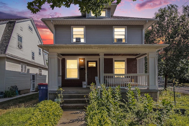 1200 Sherman St SE, Grand Rapids, MI 49506 - american foursquare style home featuring a porch