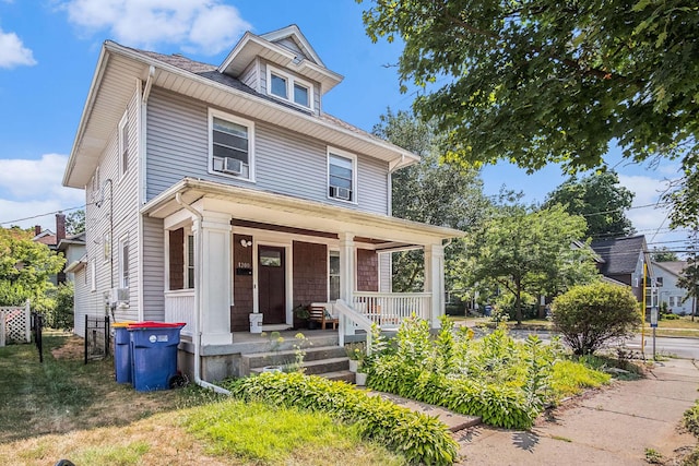1200 Sherman St SE, Grand Rapids, MI 49506 - american foursquare style home with a porch