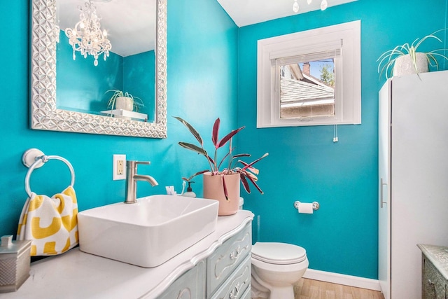 1200 Sherman St SE, Grand Rapids, MI 49506 - bathroom featuring vanity and wood finished floors