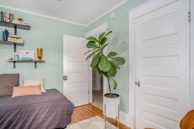 1200 Sherman St SE, Grand Rapids, MI 49506 - bedroom featuring wood finished floors and crown molding