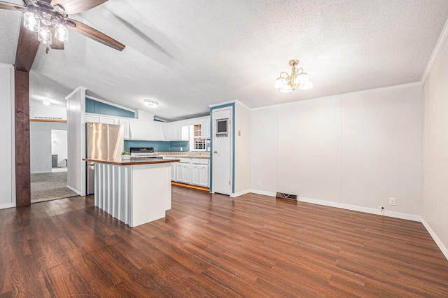 2141 S Parsons Ave, Fremont, MI 49412 - kitchen featuring freestanding refrigerator, a textured ceiling, dark wood-style flooring, a chandelier, and ceiling fan