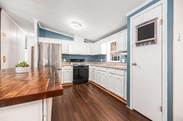 2141 S Parsons Ave, Fremont, MI 49412 - kitchen featuring gas range, vaulted ceiling, white cabinetry, dark wood-style floors, and a textured ceiling