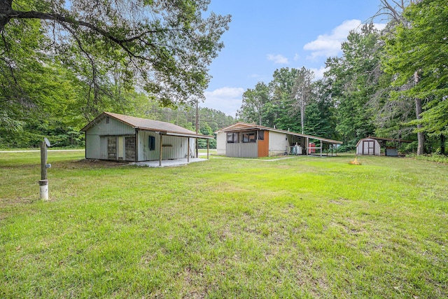 2141 S Parsons Ave, Fremont, MI 49412 - view of green lawn featuring a shed and view of wooded area