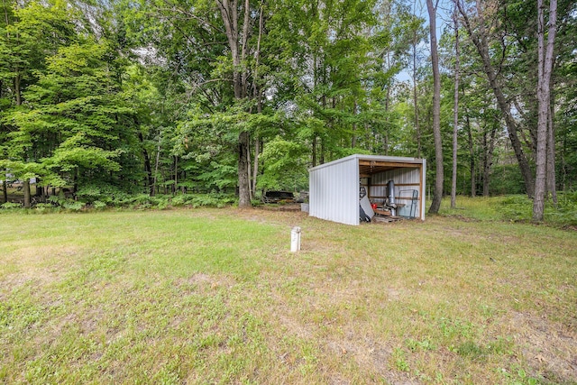 2141 S Parsons Ave, Fremont, MI 49412 - view of grassy yard featuring a pole building, an outbuilding, and a carport