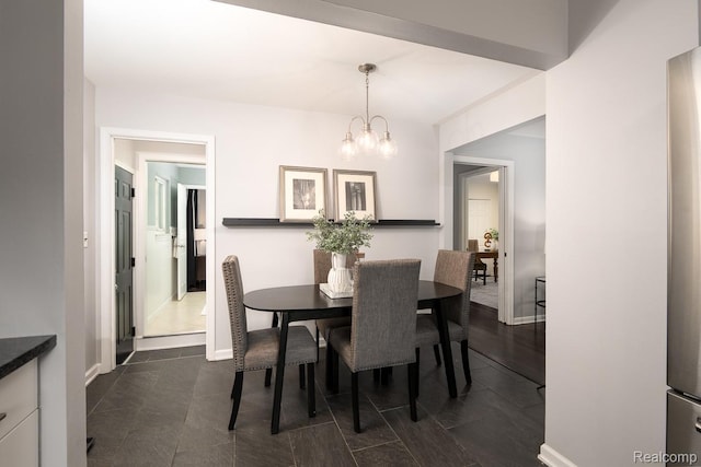 3410 N Main St, Royal Oak, MI 48073 - dining area featuring a chandelier and baseboards