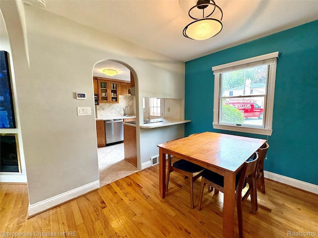 1983 Graefield Rd, Birmingham, MI 48009 - dining room with light wood-style floors and arched walkways