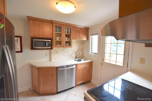 1983 Graefield Rd, Birmingham, MI 48009 - kitchen with appliances with stainless steel finishes, extractor fan, decorative backsplash, light countertops, and glass insert cabinets