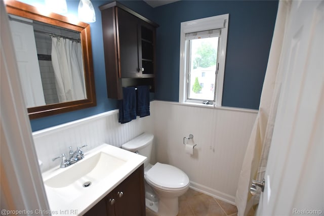 1983 Graefield Rd, Birmingham, MI 48009 - bathroom featuring wainscoting, vanity, tile patterned floors, and curtained shower