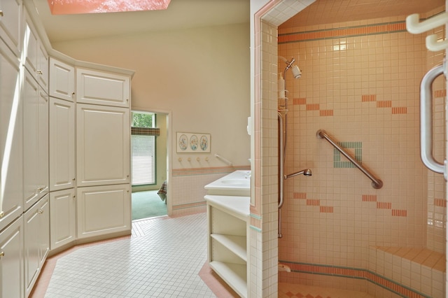 5 Mission Rdg, Frankenmuth, MI 48734 - bathroom with a stall shower, tile patterned flooring, a wainscoted wall, and tile walls