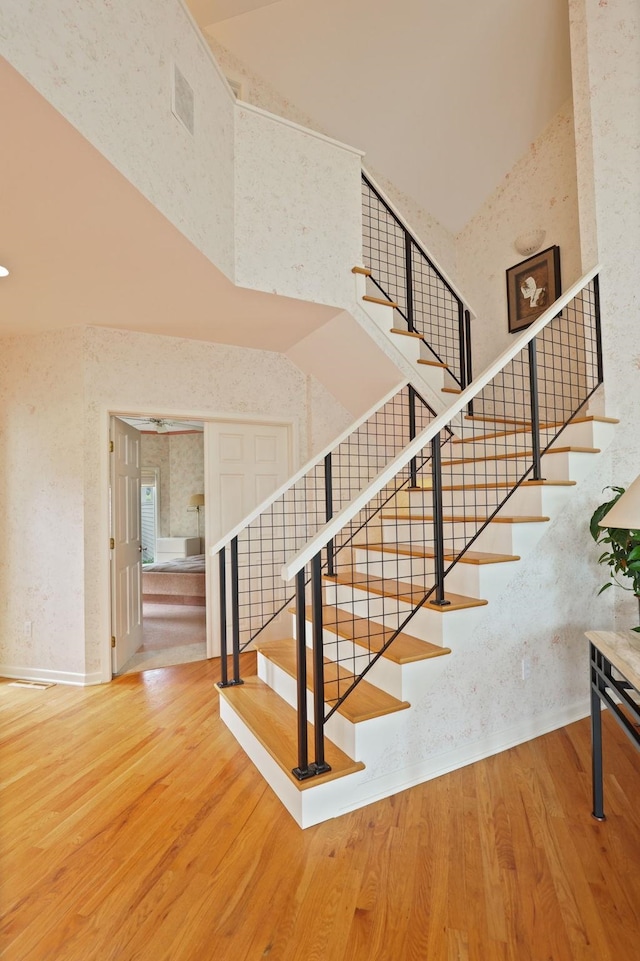 5 Mission Rdg, Frankenmuth, MI 48734 - staircase with a towering ceiling and wood finished floors