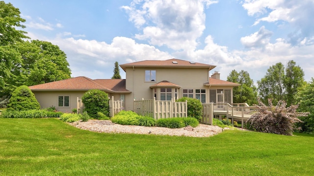 5 Mission Rdg, Frankenmuth, MI 48734 - back of house featuring a sunroom, a yard, and a wooden deck