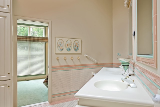 5 Mission Rdg, Frankenmuth, MI 48734 - bathroom with wainscoting, tile patterned floors, tile walls, and double vanity