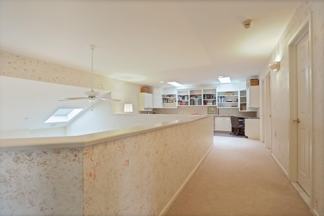 5 Mission Rdg, Frankenmuth, MI 48734 - hall featuring an office area, light colored carpet, and a skylight