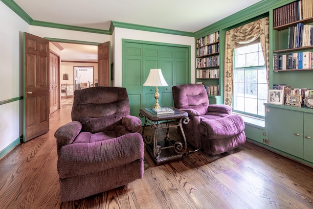 144 Barton N Dr, Ann Arbor, MI 48105 - living area with ornamental molding, wood finished floors, and built in shelves