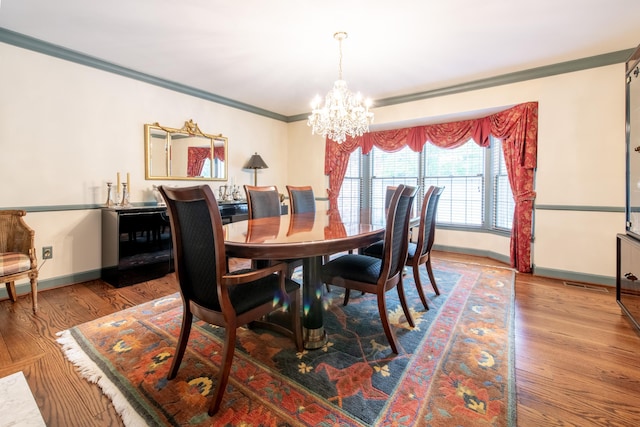 144 Barton N Dr, Ann Arbor, MI 48105 - dining room with a chandelier, crown molding, and wood finished floors