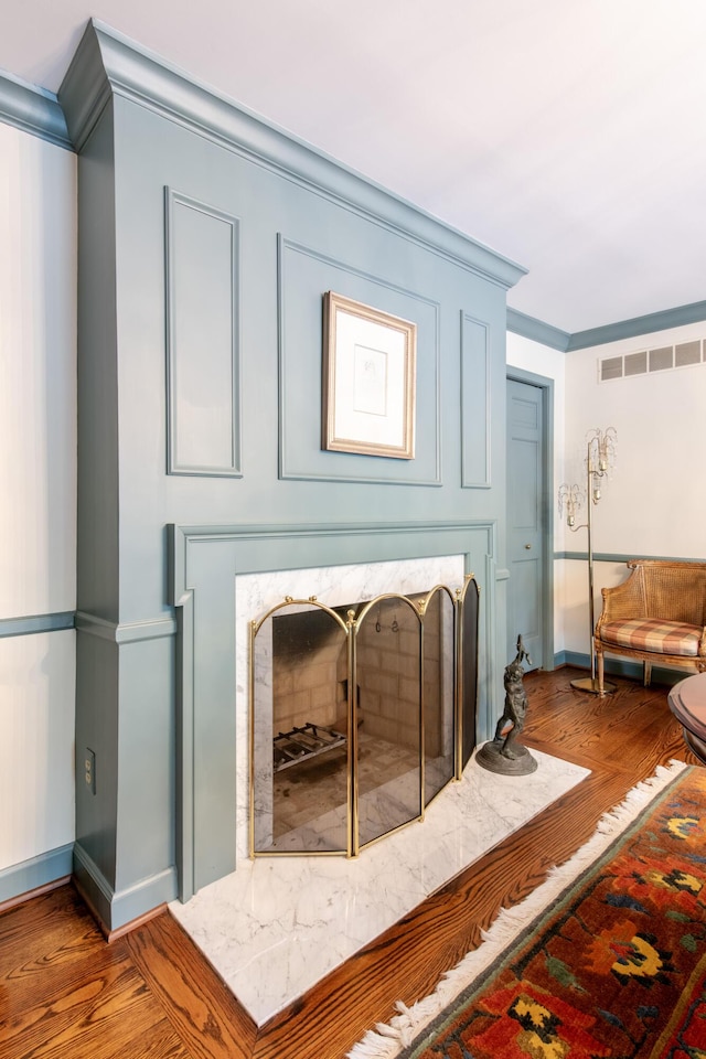 144 Barton N Dr, Ann Arbor, MI 48105 - detailed view of ornamental molding, wood finished floors, and a fireplace