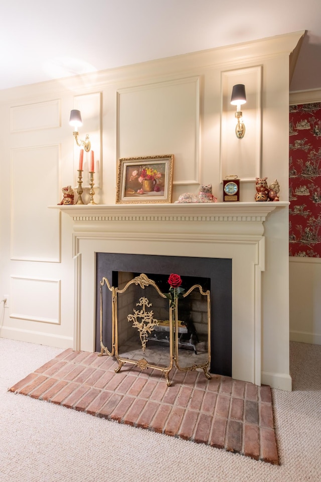 144 Barton N Dr, Ann Arbor, MI 48105 - detailed view of a fireplace with raised hearth and carpet flooring