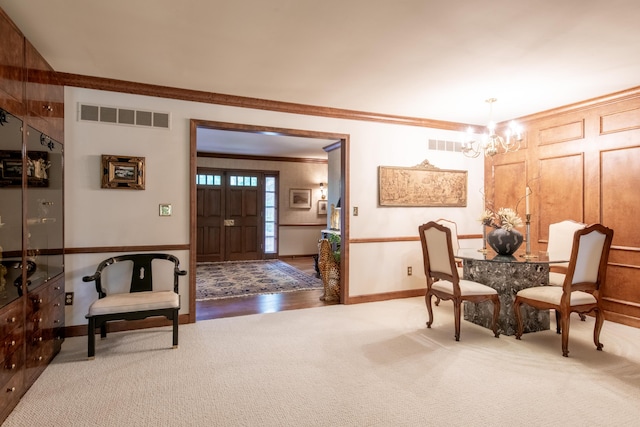 144 Barton N Dr, Ann Arbor, MI 48105 - carpeted foyer featuring crown molding and a chandelier