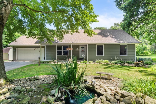 69291 Brush Trl, Niles, MI 49120 - view of front facade featuring an attached garage, a front yard, concrete driveway, and a shingled roof