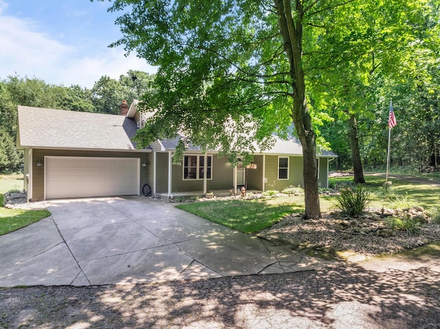 69291 Brush Trl, Niles, MI 49120 - view of front facade featuring driveway, a garage, a chimney, roof with shingles, and a front yard