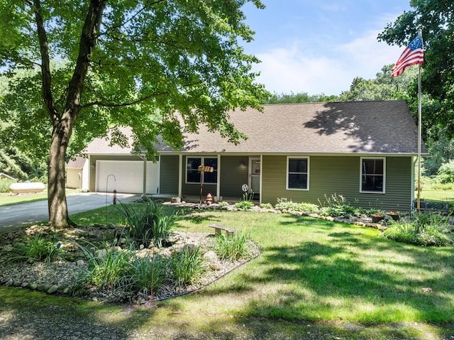 69291 Brush Trl, Niles, MI 49120 - view of front of property with asphalt driveway, a garage, a front lawn, and roof with shingles