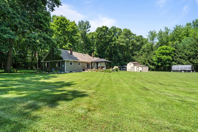 69291 Brush Trl, Niles, MI 49120 - view of grassy yard featuring a storage shed