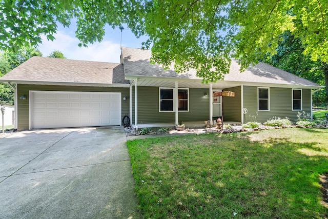 69291 Brush Trl, Niles, MI 49120 - view of front of home with an attached garage, a porch, concrete driveway, a front yard, and roof with shingles