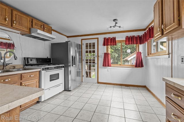 212 La Plaza Ct, Royal Oak, MI 48073 - kitchen featuring white range with gas stovetop, under cabinet range hood, stainless steel refrigerator with ice dispenser, light countertops, and light tile patterned floors