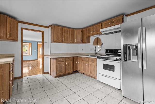 212 La Plaza Ct, Royal Oak, MI 48073 - kitchen featuring stainless steel fridge with ice dispenser, under cabinet range hood, white range with gas stovetop, light countertops, and light tile patterned flooring
