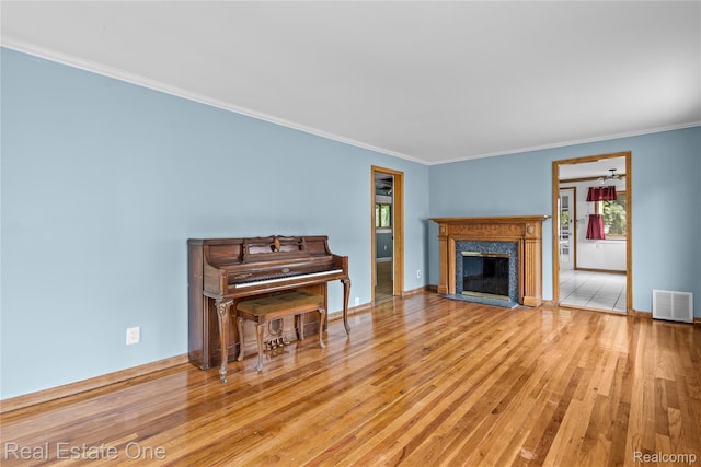 212 La Plaza Ct, Royal Oak, MI 48073 - living area featuring hardwood / wood-style flooring, a premium fireplace, and ornamental molding