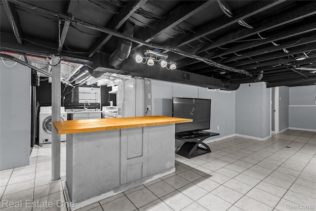 212 La Plaza Ct, Royal Oak, MI 48073 - finished basement featuring washer / clothes dryer and light tile patterned flooring